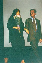 Dr. J. Gregory Payne escorts Mayr Vecchio onto stage following the 1995 production of Kent State:A Requiem at Kent State